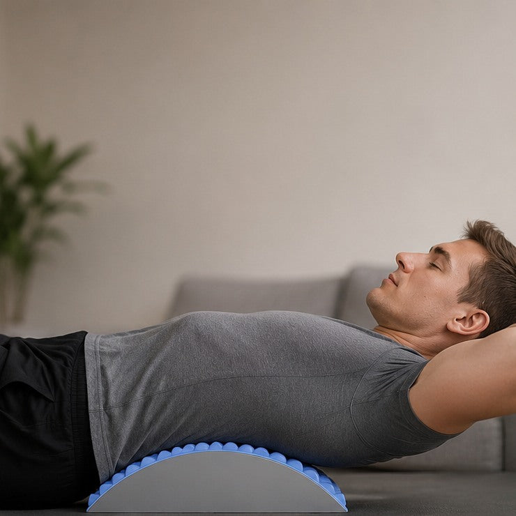The same man lying back over the Acemend arch, lower back supported, arms relaxed