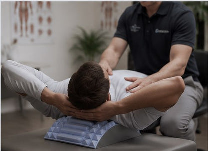 A therapist guiding a client through a session on the arch