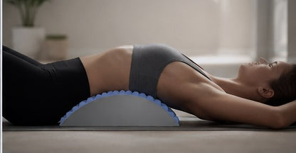 Woman lying back over the arch with it positioned under her lower back
